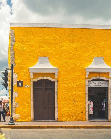 Colourful colonial street in San José del Cabo art district with yellow building facade